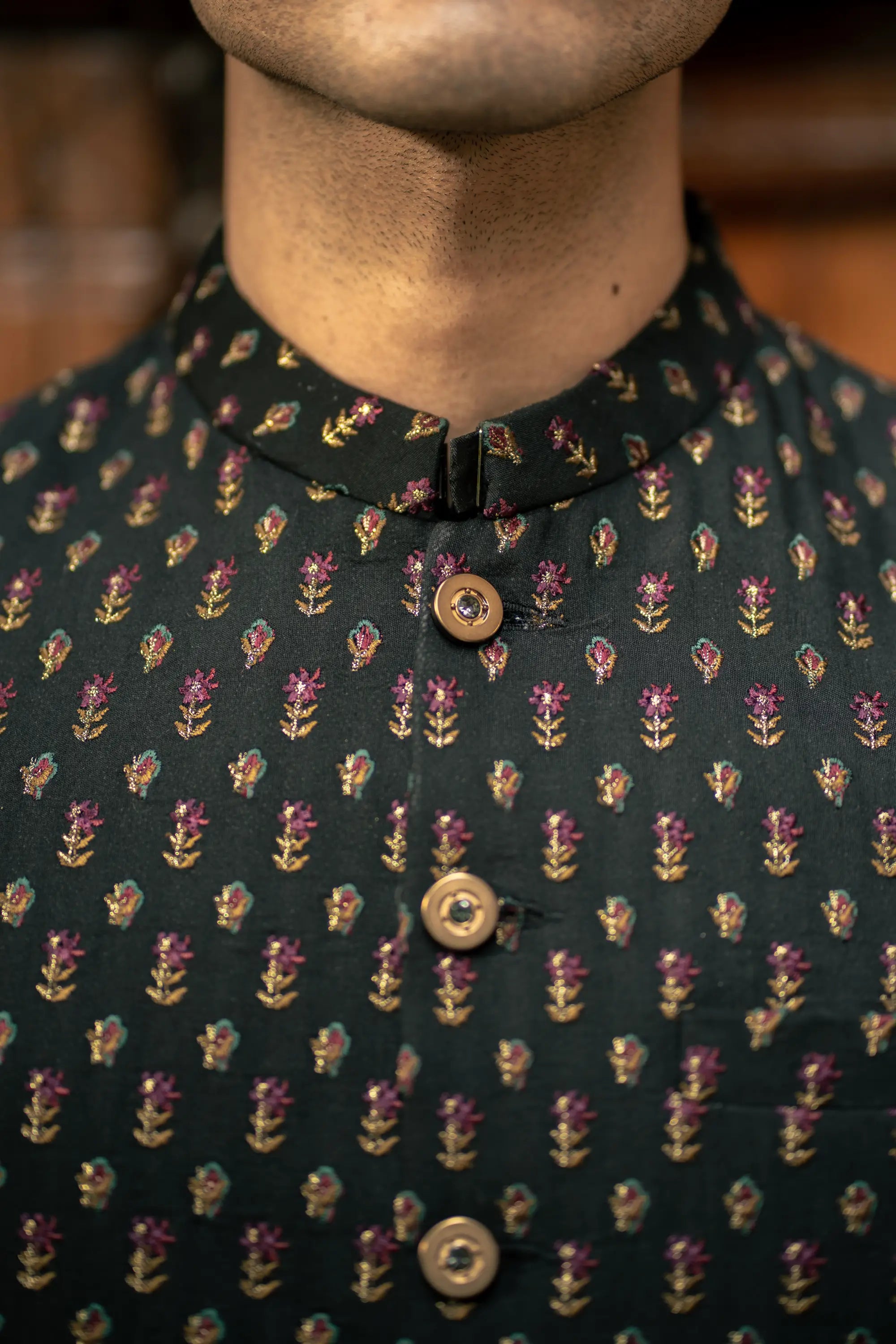 Mannequin wearing a dark shirt with floral pattern