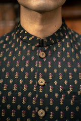 Mannequin wearing a dark shirt with floral pattern