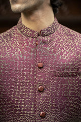 Close-up of a patterned shirt with buttons on a blurred background