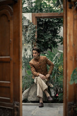 Man sitting in a garden with wooden doors open