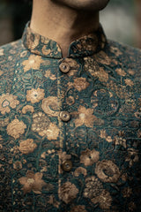 Close-up of a person wearing a floral patterned shirt with a blurred background